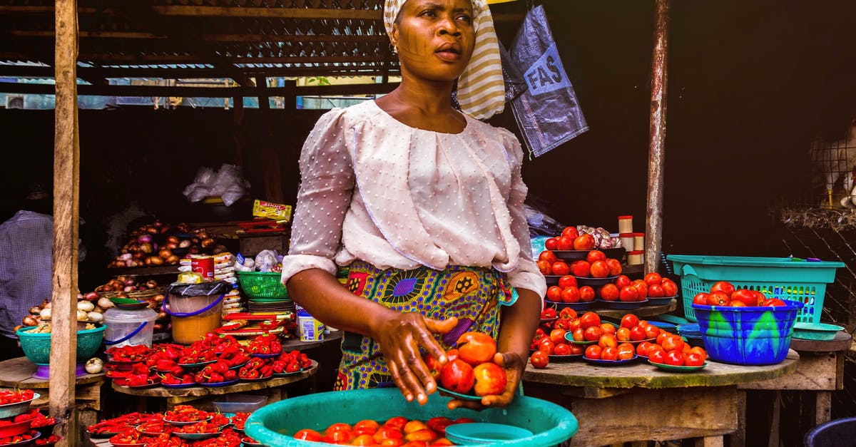 Tenderizing vegetables (chili pepper) - Woman Holding Tomatoes