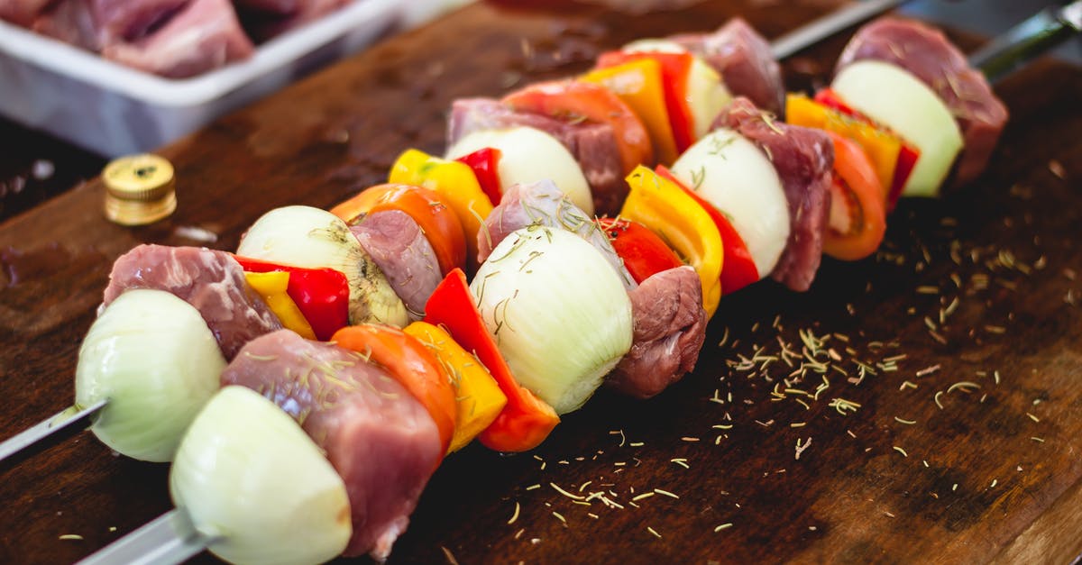 Tenderness of sous-vide pork chops - Kebab on Brown Wooden Chopping Board
