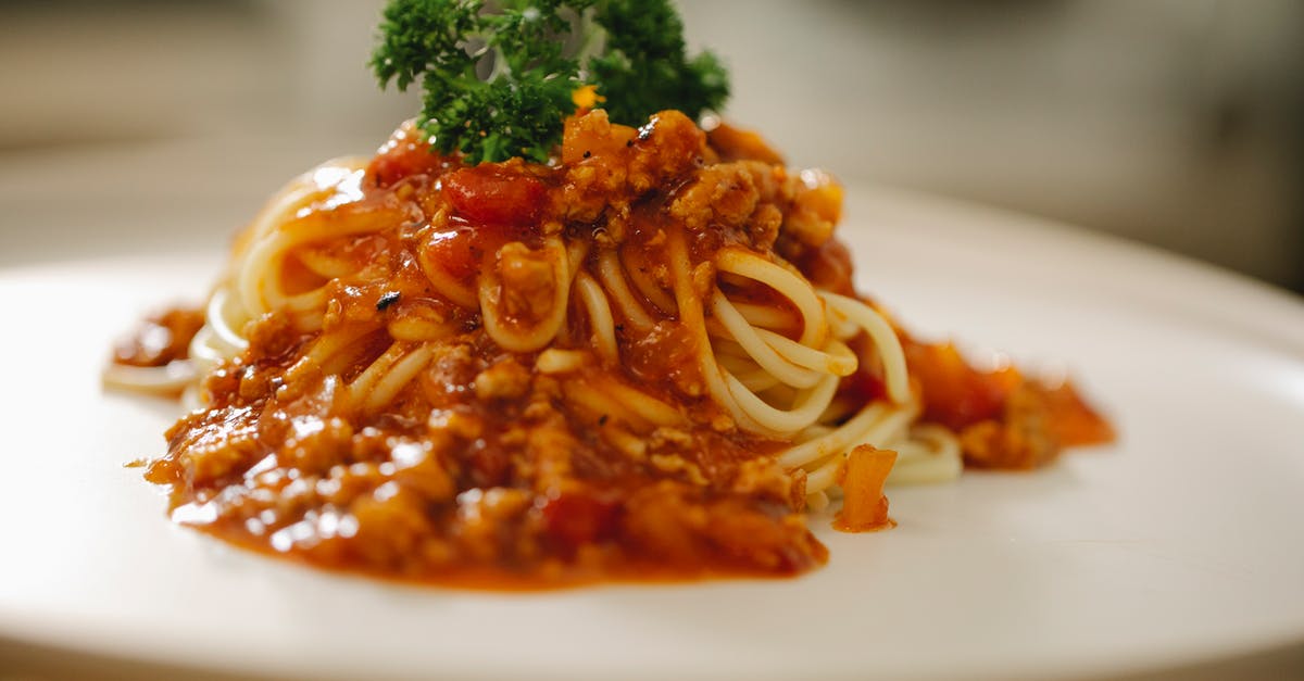 Teryaki sauce becomes viscous after boiled - Appetizing pasta Bolognese served with parsley