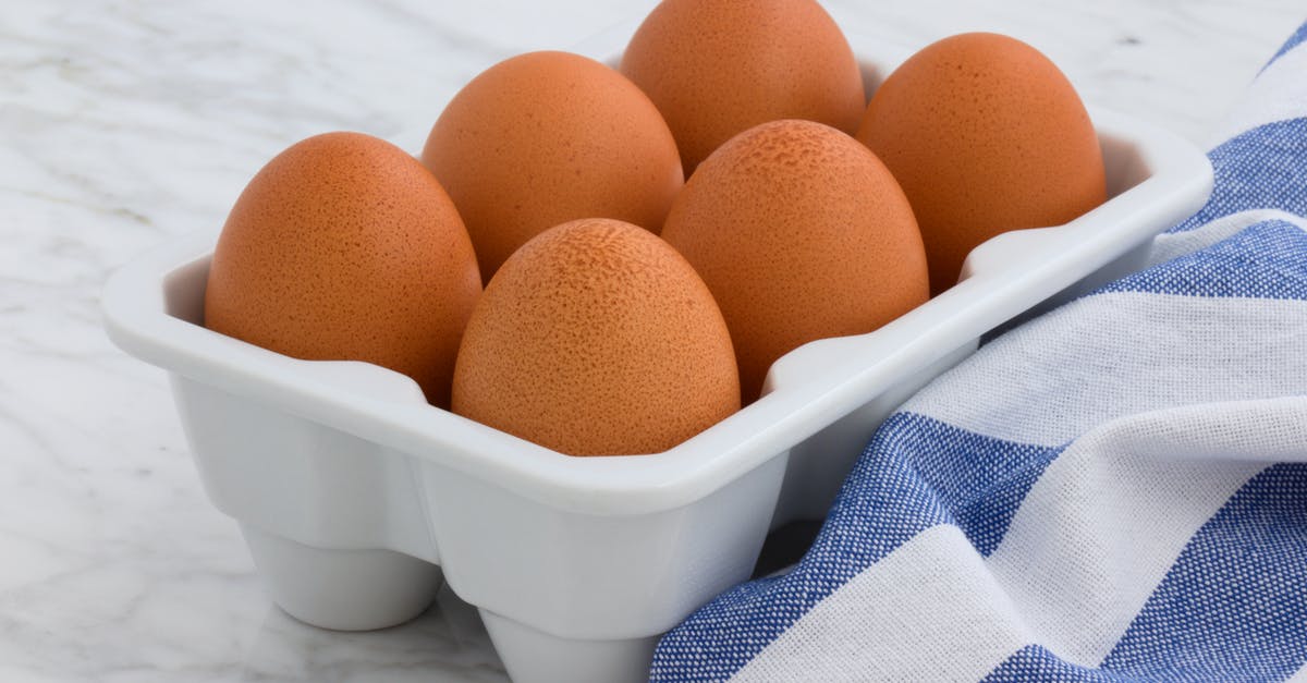 Testing For Salmonella in raw eggs - Six Organic Eggs on White Tray