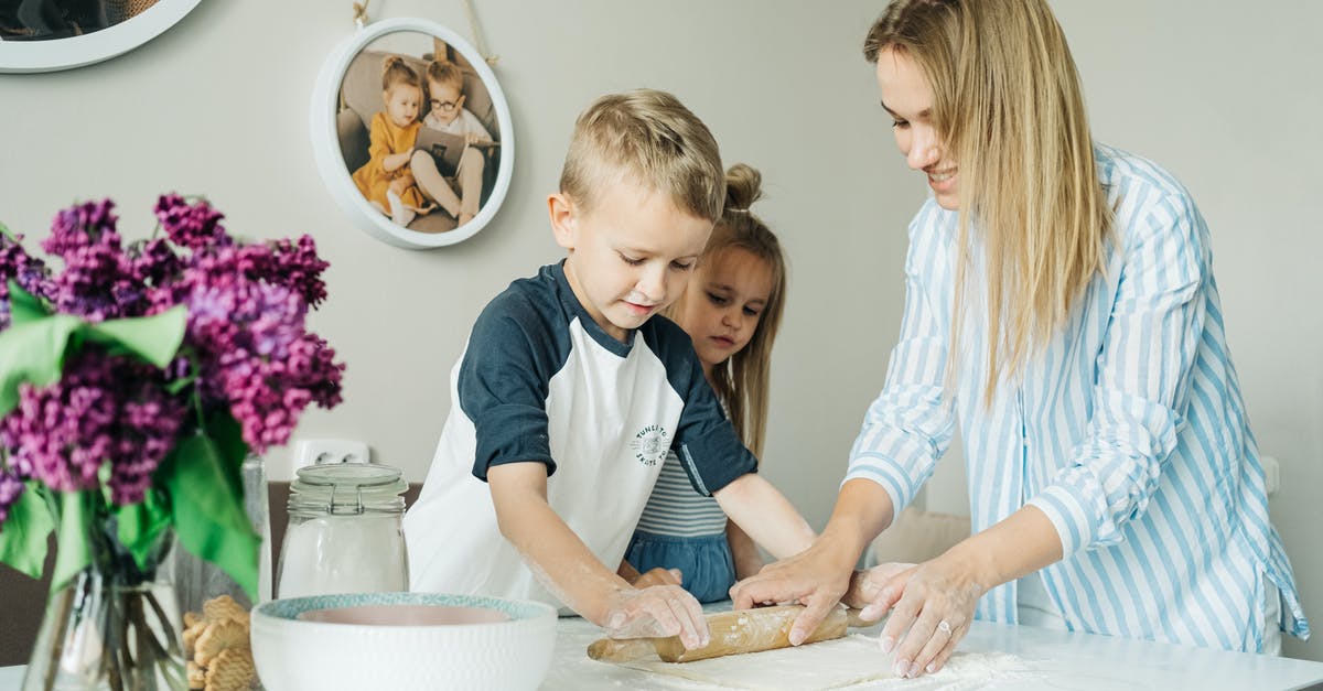 The Mother Dough Blues - A Boy Using a Rolling Pin on Dough