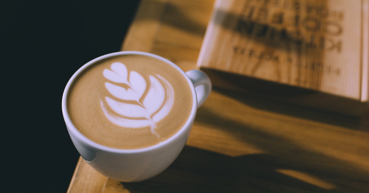 The Perfect Smoothie - Liquid Milk versus Powdered Milk - Cup of coffee with art on milky foam