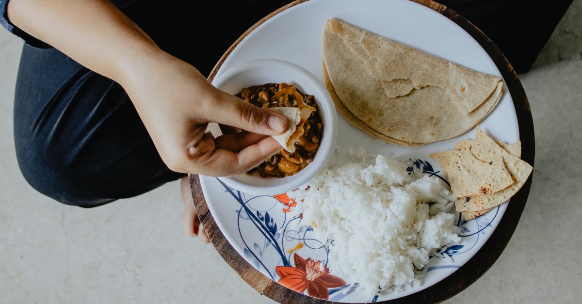 The ultimate chapati [closed] - White Rice on White and Red Floral Ceramic Plate