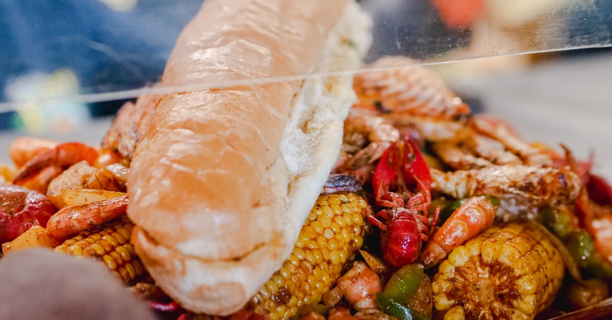 thick, crunchy, fluffy corn flakes breading - Cooked Seafoods with Brown Bread on Top