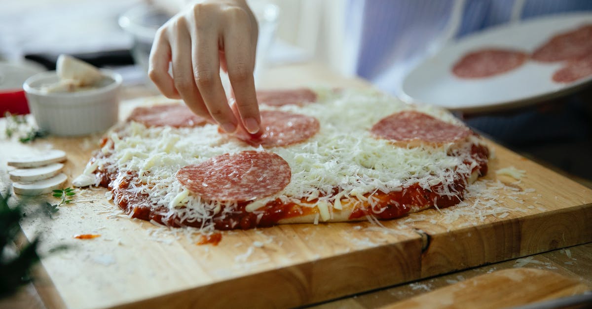 Thicker gelatin layer at the bottom of the dish - Anonymous person cooking homemade pizza