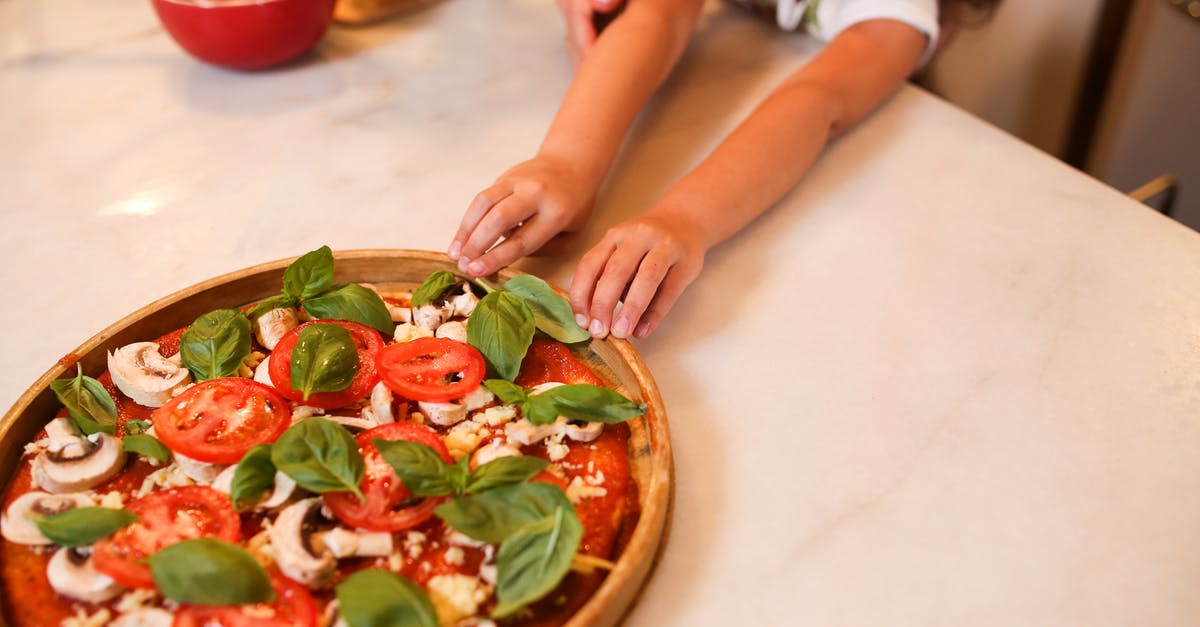 Tips To Make Pizza Dough Workable - Person Holding Brown Round Plate With Vegetable Salad