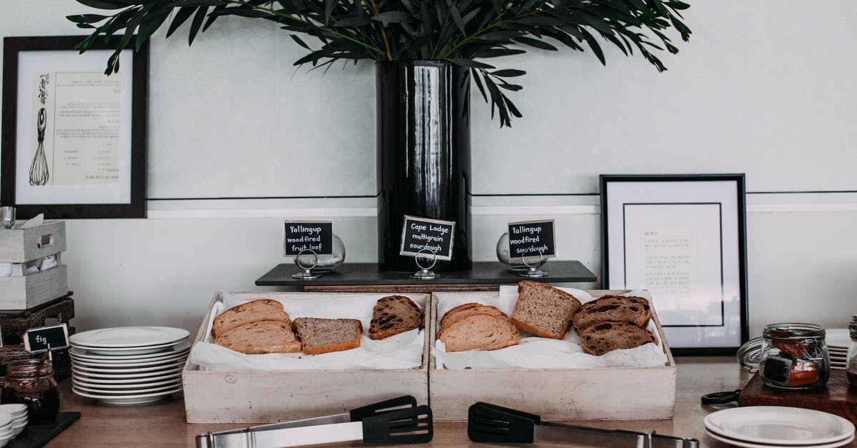 Toast bread slices in a convection microwave? - Wooden table with slices of assorted for breakfast in banquet rom of restaurant