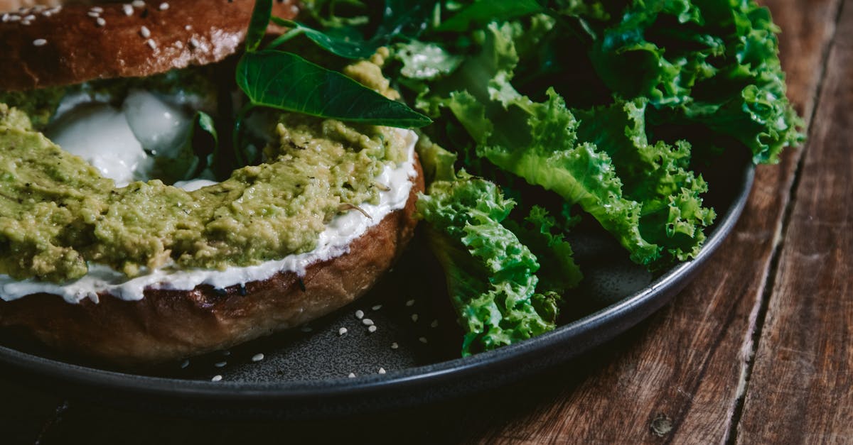 Toasting bagel in my oven - Close-up Photo of Bagel Bread with Avocado Spread