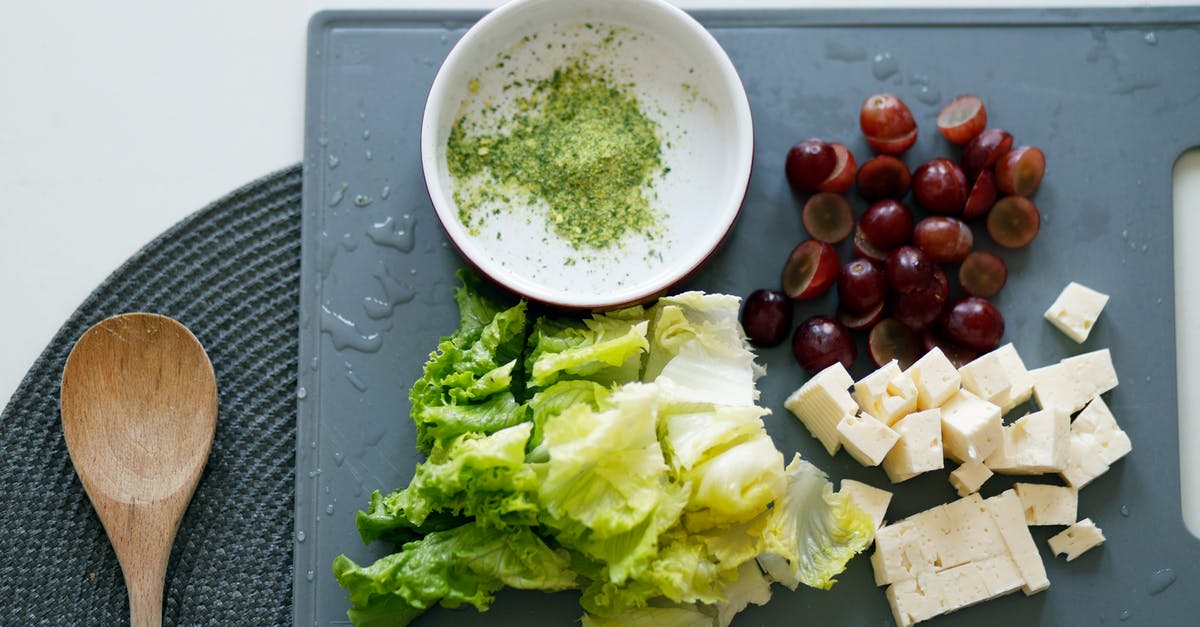 Tofu - Cooking technique for firm/chewy edges? - Slice Tofu, Dates and Lettuce on Grey Chopping Board