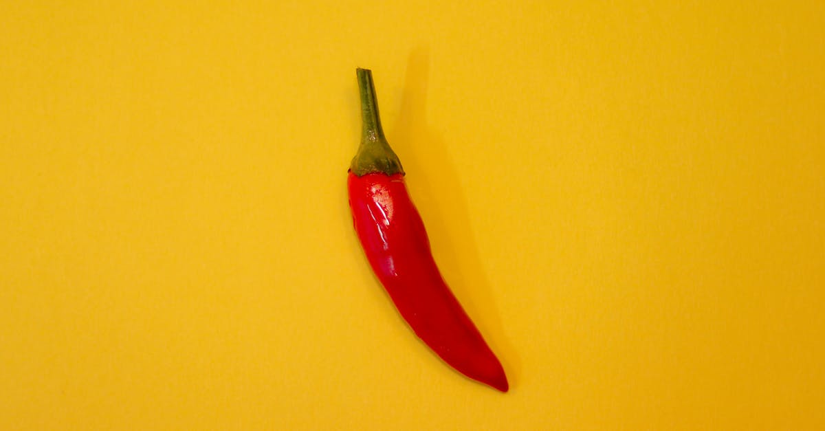 toning down the fresh chilli picquancy - Red Chili on Yellow Surface