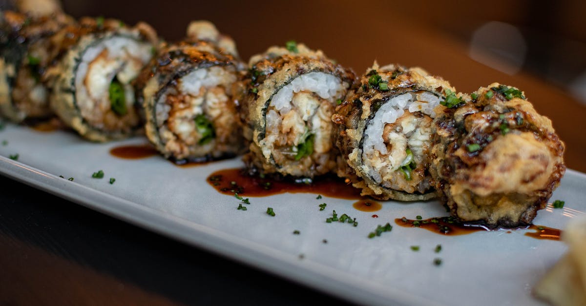 Tootsie Roll Flavor - Delicious sushi in sauce on white dish