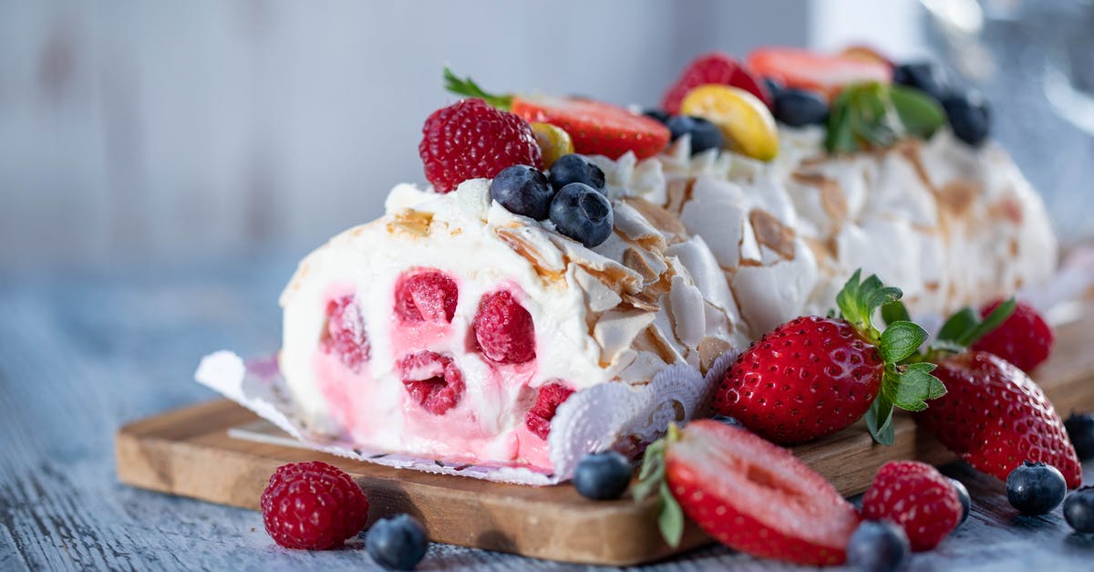 Tootsie Roll Flavor - Sweet meringue roll with cream and berries