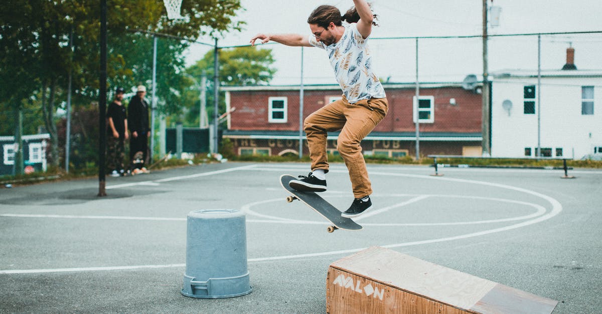 Tricks for removing sausage casing? - Man in Blue Shirt and Black Pants Riding Skateboard