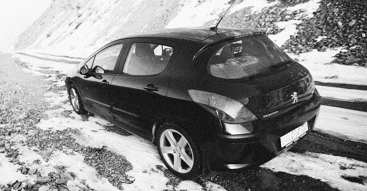 Trimming ends off snow peas - A Car Parked on the Snow Covered Mountain Road