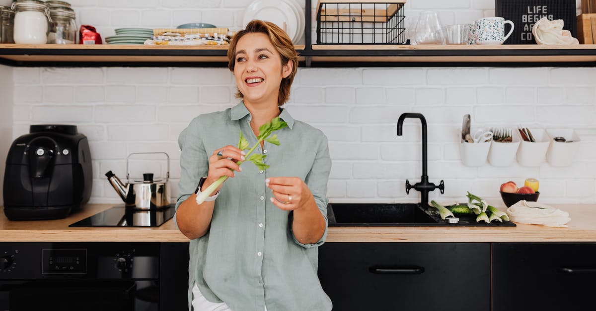 Troubleshooting: Kitchen Sink Vegetable Soup - Woman in White Long Sleeve Shirt Holding Green Plastic Cup