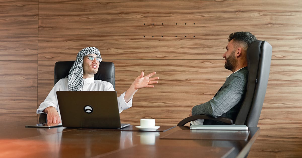 Turkish Coffee necessities - Men Sitting on Office Chairs while Having Conversation