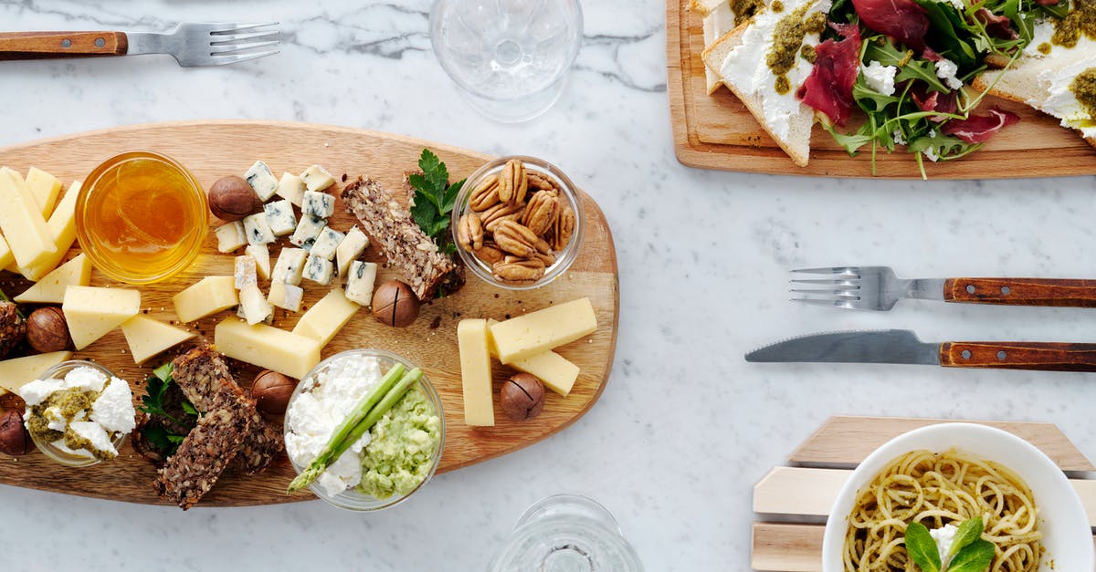 Two Dishes at once - Sliced Bread With Sliced Vegetables on Brown Wooden Chopping Board