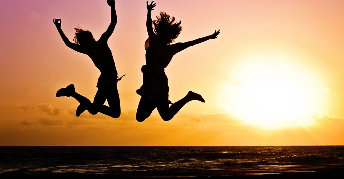 Two Dishes at once -  Silhouette Photography Of Jump Shot Of Two Persons 