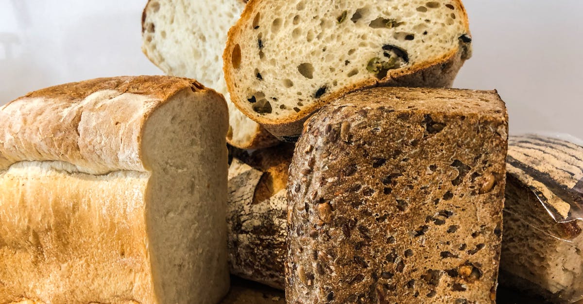 Unscored loaf is sealing up - Pile of Sliced Wheat Breads