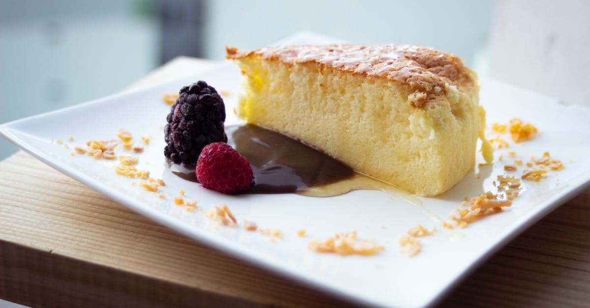 Unwanted rise in Japanese Cheesecake - Close-Up Photo of a Slice of Cheesecake Beside Raspberry Fruits