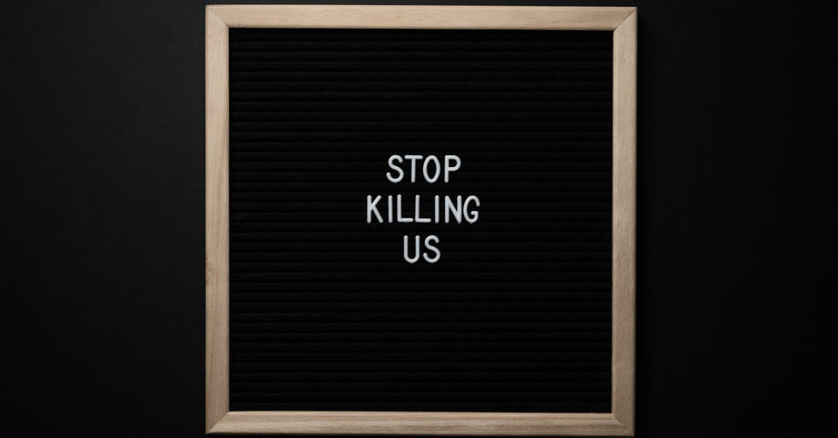 U.S. Equivalent of French T80 for Sourdough Pain de Campagne - Top view of slogan Stop Killing Us on surface of square blackboard on black background