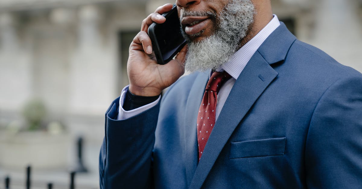 Uses of dittany of Crete (origanum dictamnus) - Man in Blue Suit Taking on the Cellphone