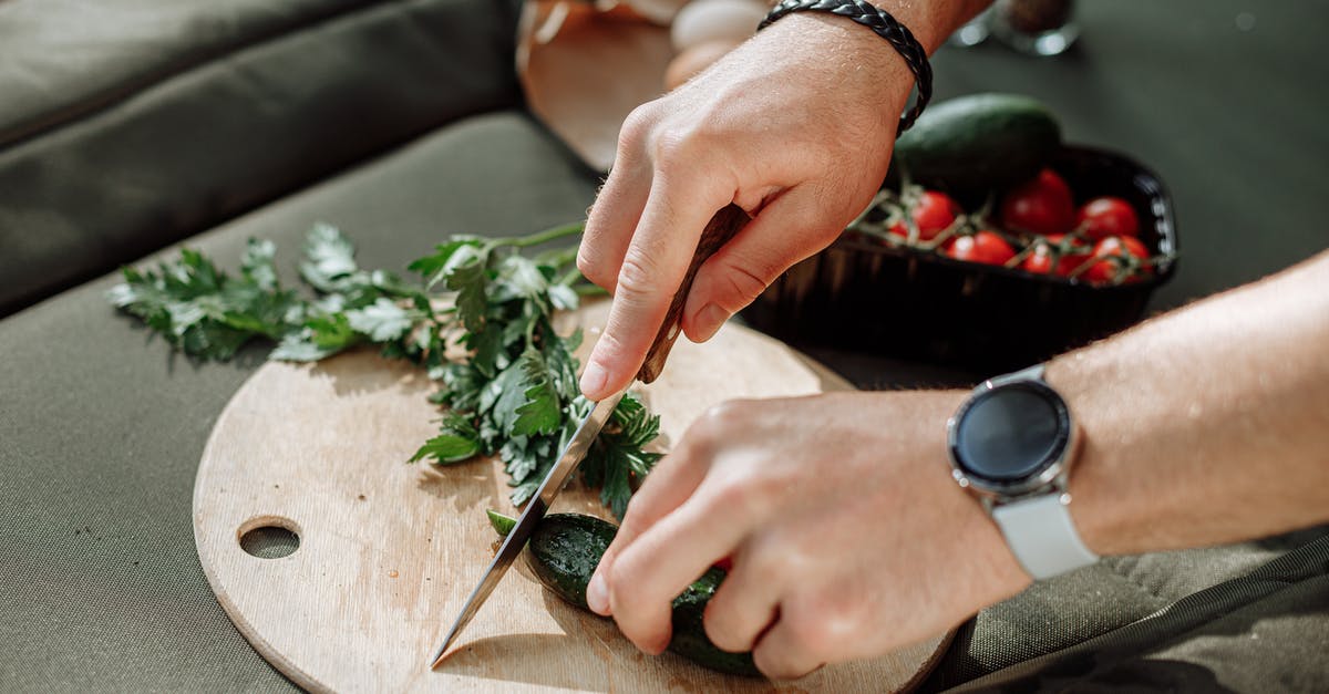 Uses of leftover vegetables from slow cooker - Person Holding Knife Slicing Vegetable