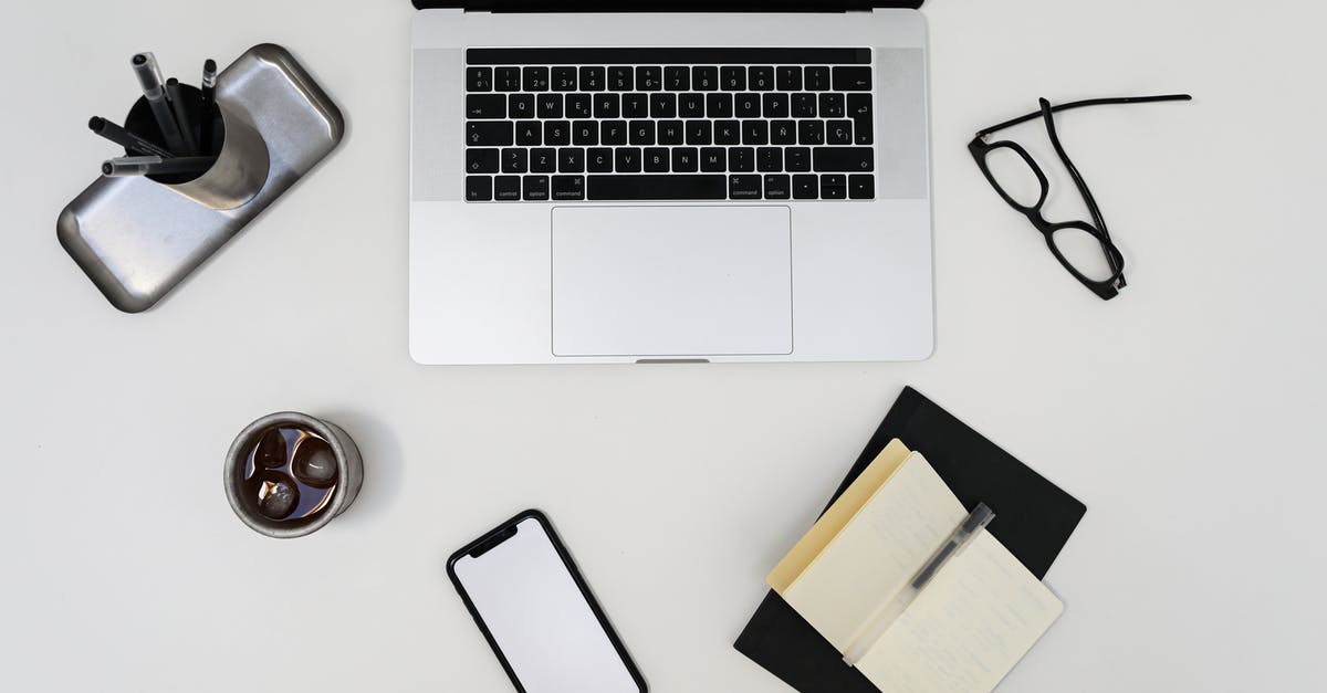 Using acidity to brighten simple sides like purees - Top view of modern laptop and smartphone with empty screens placed near opened notebook and eyeglasses on light table