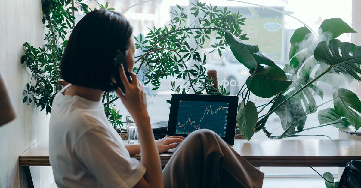 Using cloves in stocks/broths - Businesswoman in White Shirt Sitting on Chair while Having Phone Call