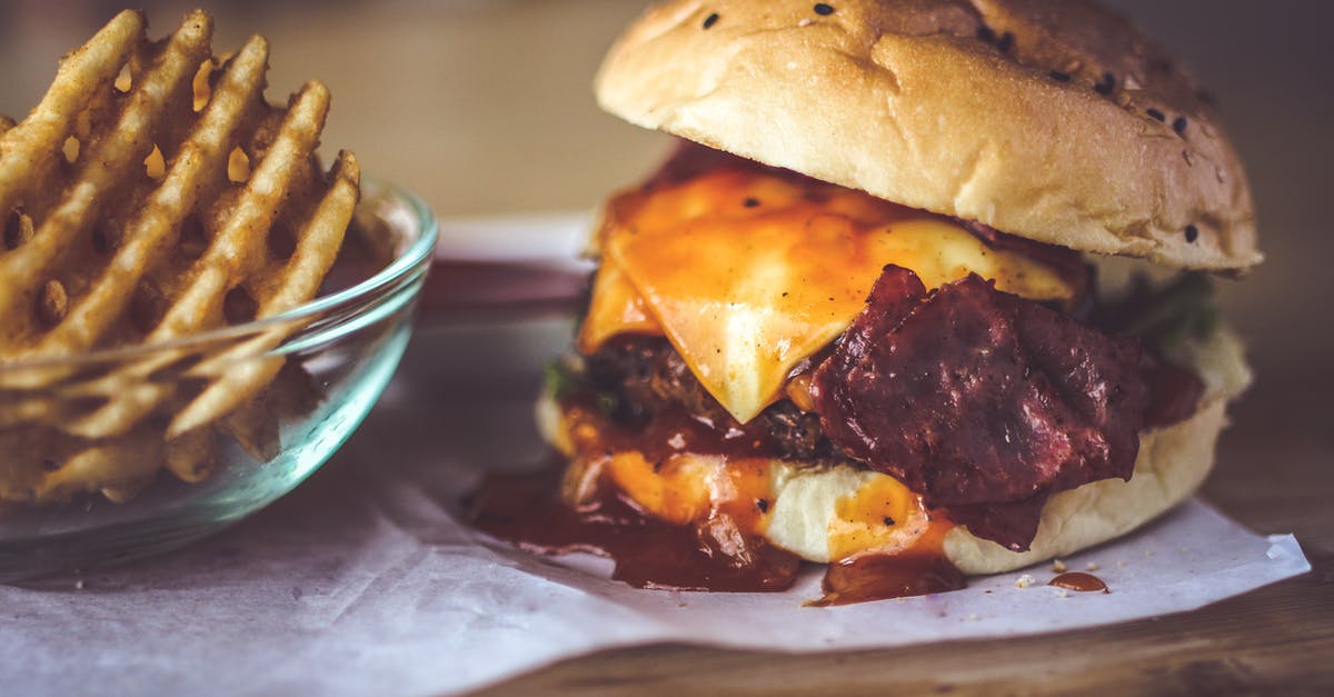 Using cream cheese instead of cheddar in a grilled cheese sandwich - Closeup Photography of Bun With Cheese, Patty, Egg, and Bacon