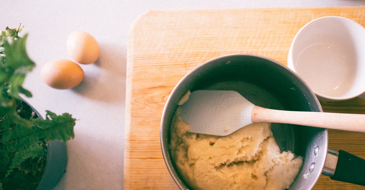 Using fridge for slow rise dough with eggs - Pot With Spatula on Brown Chopping Board