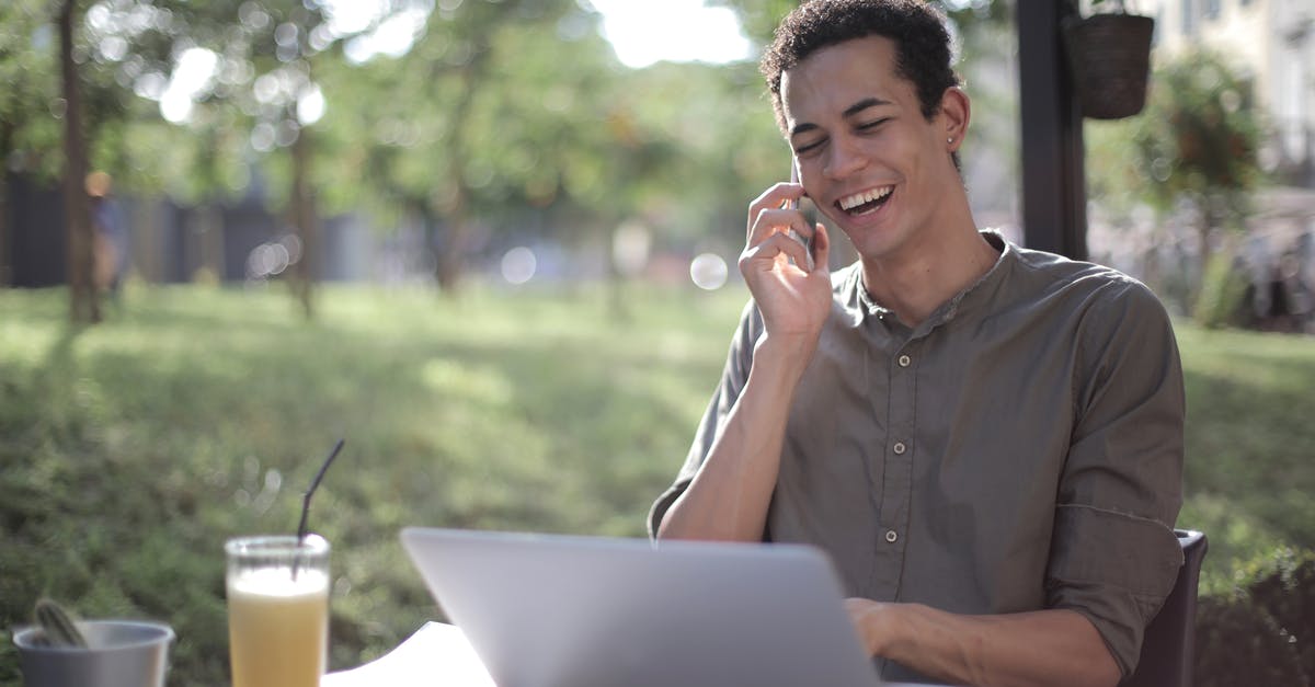 Using left over pickle juice to make more pickles [duplicate] - Content African American male freelancer wearing casual clothes sitting at table in street cafe with laptop and speaking on cellphone while working on startup