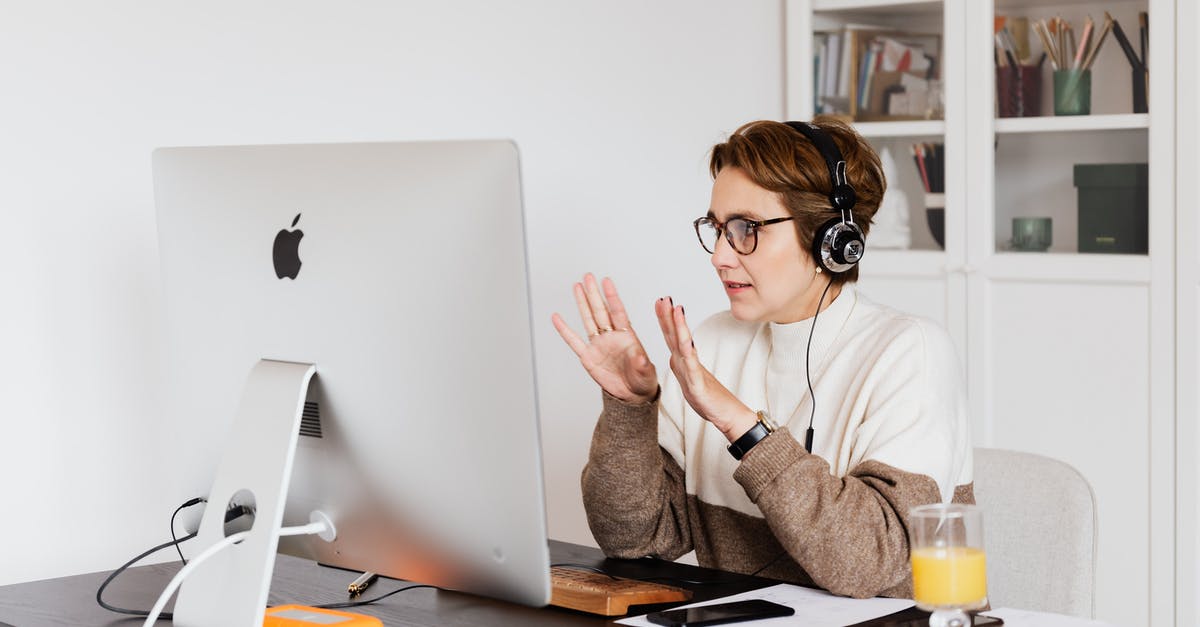 Using left over pickle juice to make more pickles [duplicate] - Content woman using computer during video call