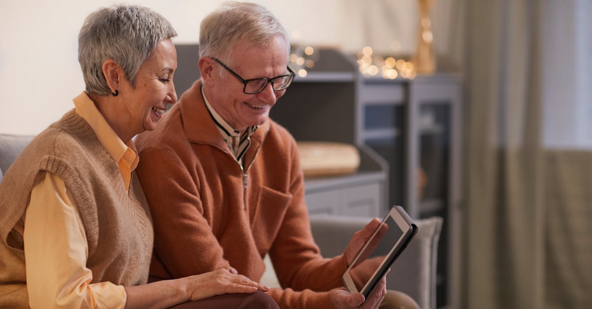 Using older frozen vegetables - Couple Smiling While Looking at a Tablet Computer