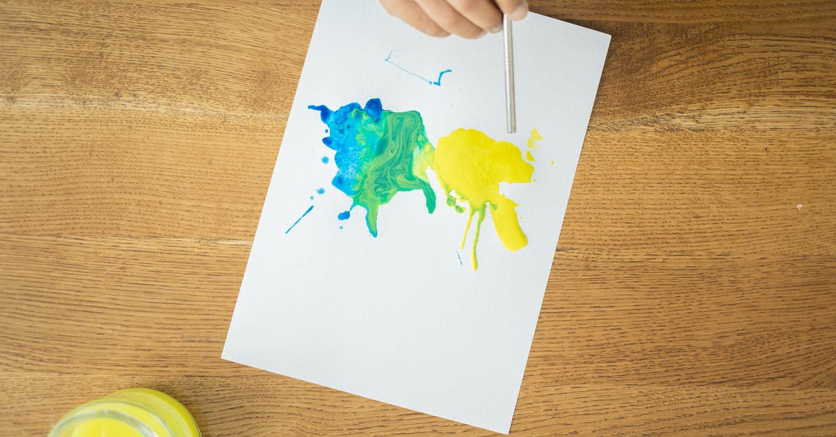 Using other liquid than water when making stock - From above of crop unrecognizable kid drawing with watercolors using straw on wooden table with glass jar of water