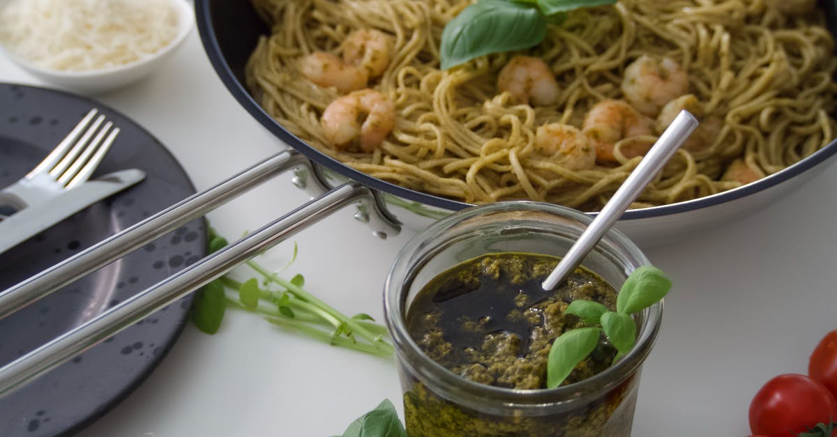 Using pesto as a sauce ingredient - Pesto Noodles in Close-Up Photography