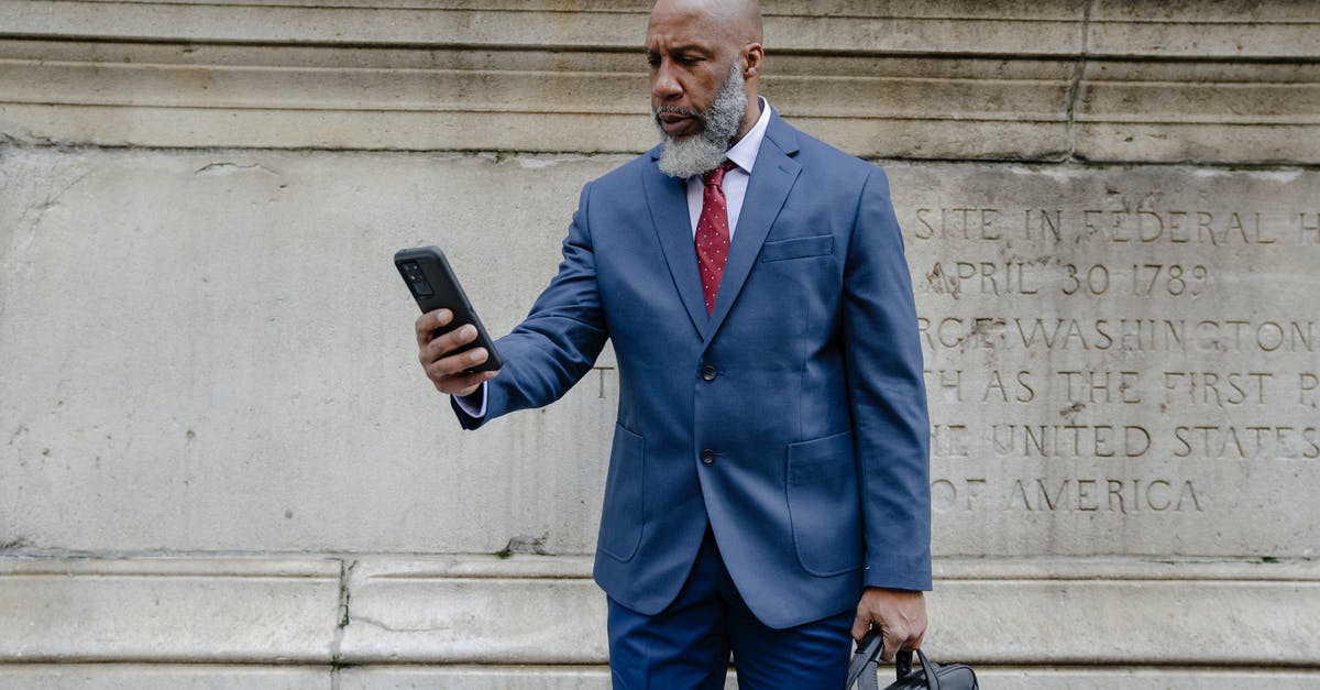 Using powdered salt vs regular - Man in Blue Suit Jacket Holding Black Smartphone