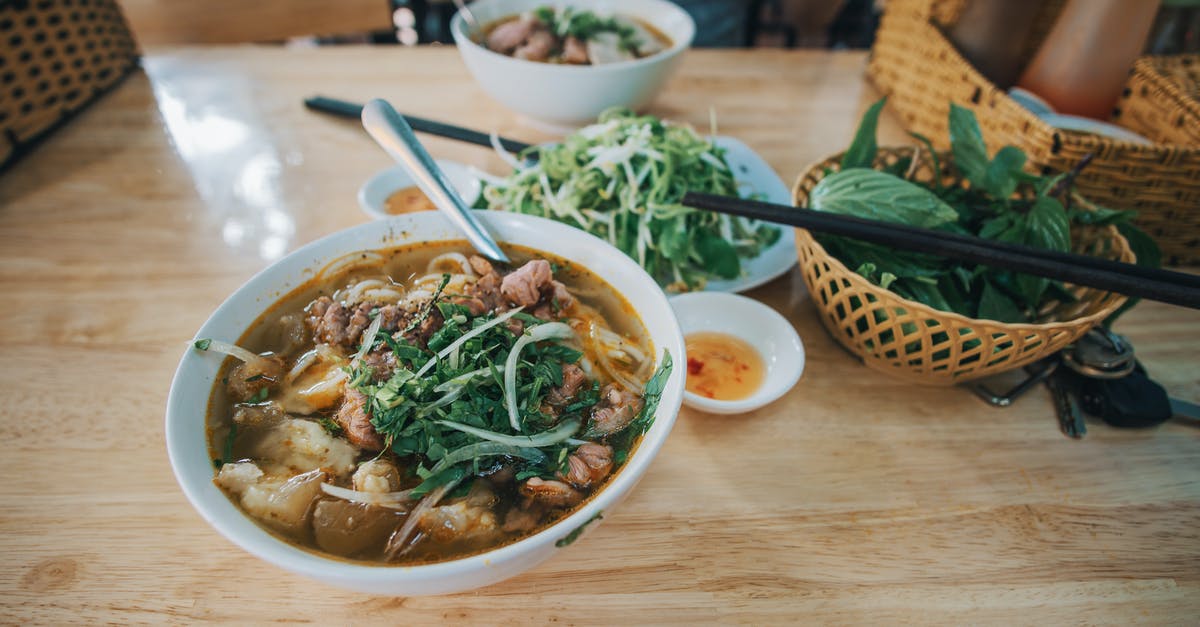 Using sauce as a soup base - Cooked Dish Beside Green Leafy Vegetables on Table