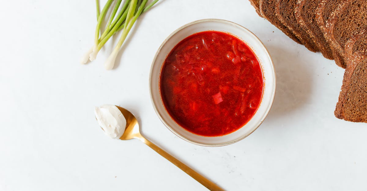 Using sauce as a soup base - Red Sauce in White Ceramic Bowl and Bread on White Surface