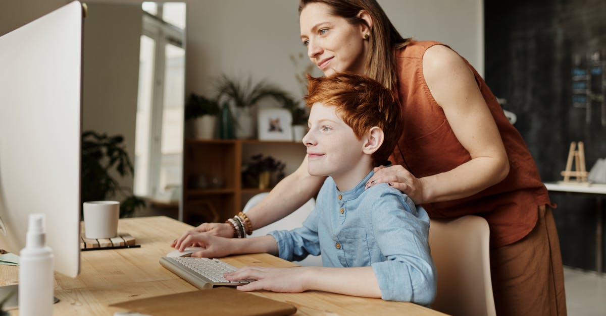 Using seltzer to help a marinade - Photo of Woman Teaching His Son While Smiling