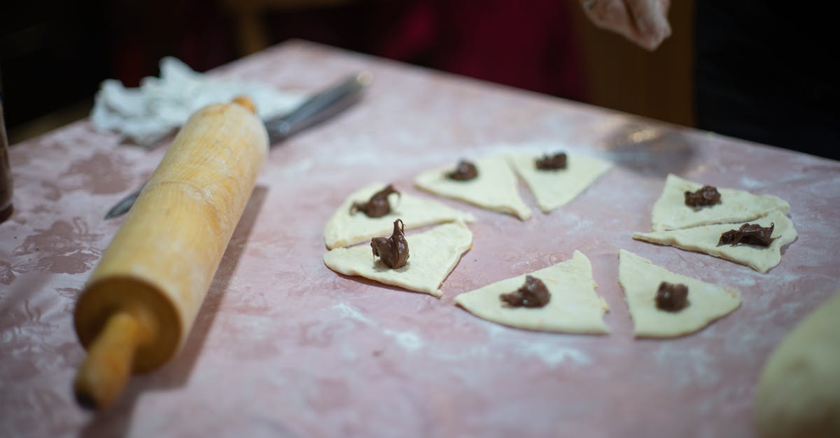 Using sugar when making pizza dough - Brown Wooden Rolling Pin on White Textile