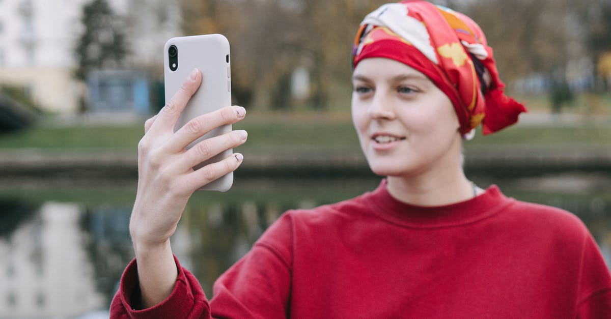 Using the right acid for red curry - A Woman Wearing Red Headscarf Using a Smartphone