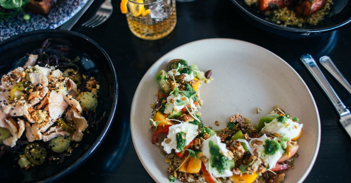 Utensil that forms meat into cylinders - Plates filled with tasty meal on table Utensil that forms meat into cylinders - Plates filled with tasty meal on table