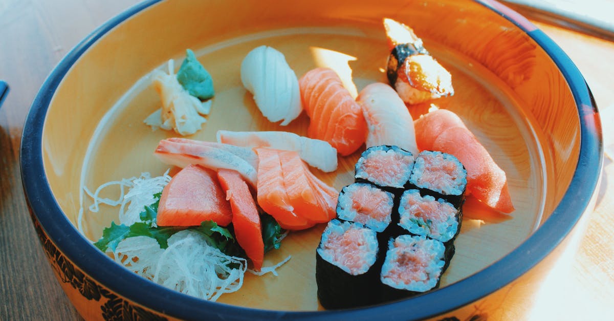 UV lamp to disinfect raw sushi fish slices - Delicious assorted sushi and rolls in bowl