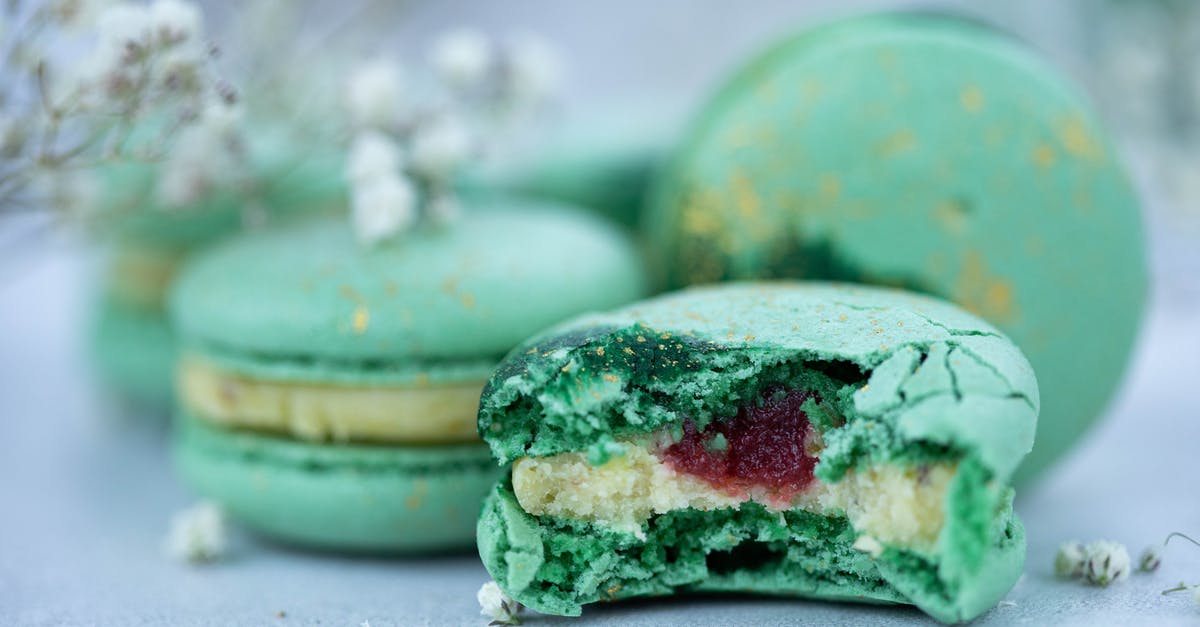 Vacuum sealing jars of Simple Syrup - Sweet green macaroons with syrup and cream