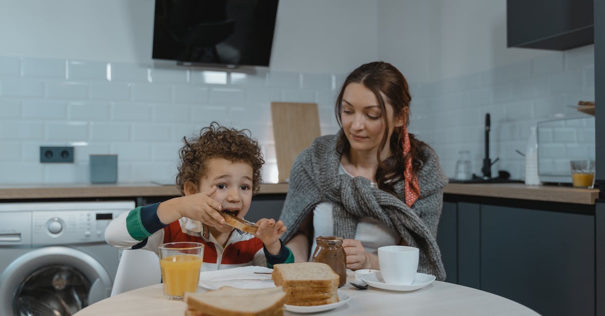 Vietnamese Sandwiches - Spread Identification? - A Kid Eating Sandwich with Chocolate Spread with Her Mother