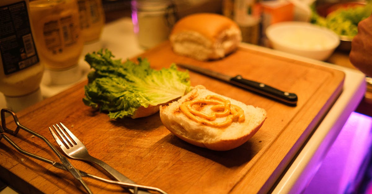 Vietnamese Sandwiches - Spread Identification? - Stainless Steel Fork Beside Bread Knife and Bread Knife on Brown Wooden Chopping Board