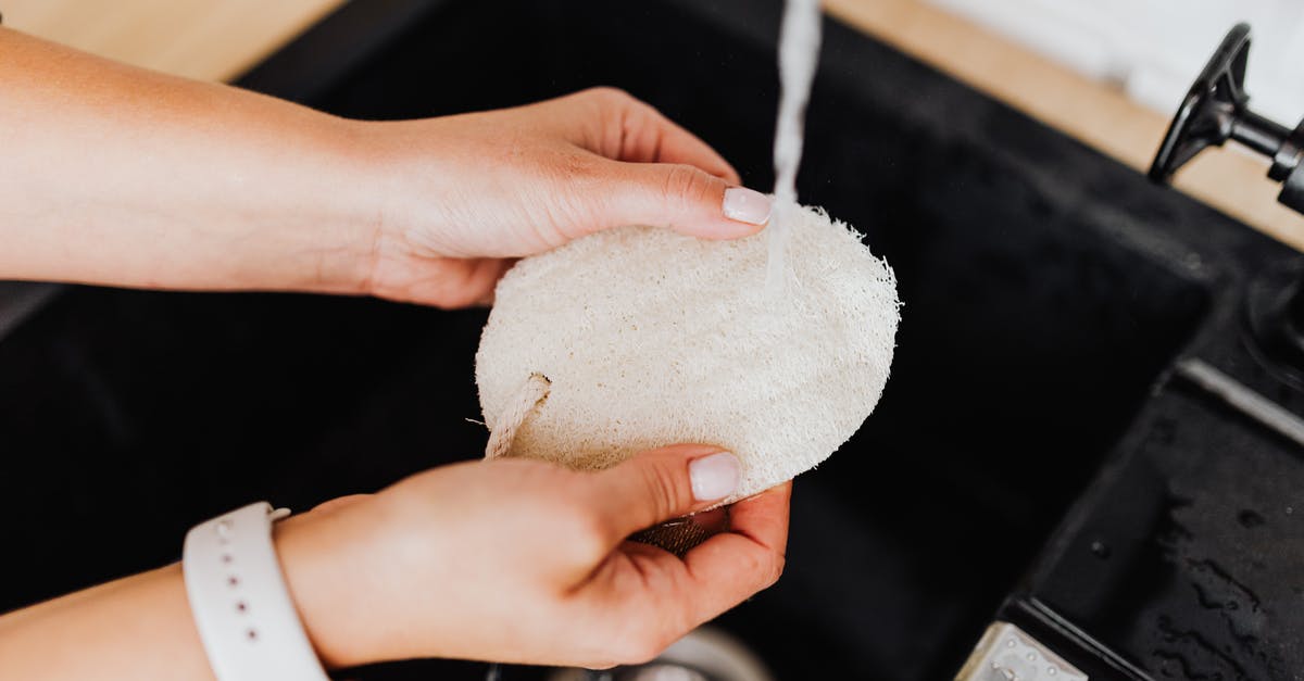 Washing oil off of hands - Washing Item in Sink