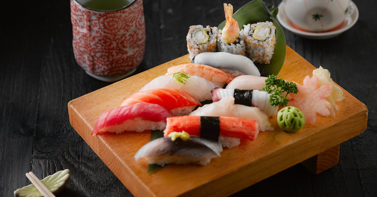 Washing or rinsing fish and seafood - Sushi On Brown Wooden Board