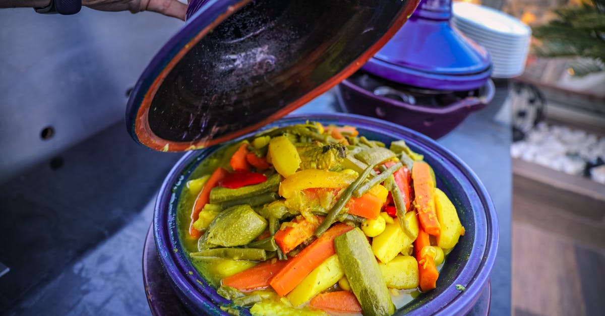 Water repellent-like residue on pot when cooking vegetables - Close-Up Photo of Cooked Vegetables on Pot